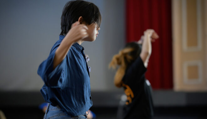 Two artists move through an indoor space. Photographer: Ben Searcy, courtesy of CAAP - Contemporary Asian Australian Performance