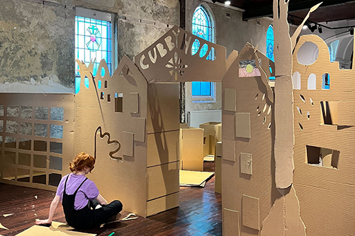 A Polyglot artist works on the Cubbyhood set.