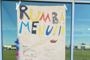 Polyglot & Rumbalara Kids Collaborations photo: Lexie Wood. 'Rumba Menu' on brown parchment paper, written in different markers by children.