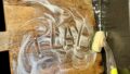Photo: Lauren Swain. The word 'play' written in dishwashing foam on a wooden chopping board.