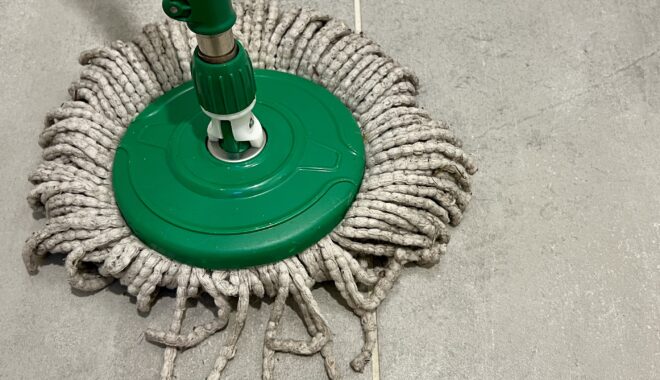 Photo: Lauren Swain. The word 'play' formed out of the strings on a mop.