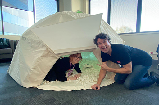 An Arts-Health session. Two Polyglot artists pose with the white Voice L.ab dome. Photo: Cat Sewell
