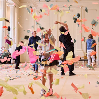 Whirlwind production photo: Laura May Grogan. Children, families and Polyglot artists create and play in a swirl of colourful paper confetti.