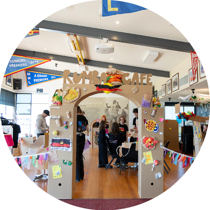 Rumba Cafe photo: The cardboard entrance of Rumba Cafe, featuring paper creations and drawings. Photo: Keneisha Howell