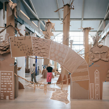 Paper Planet production photo: Nasser Hashemi, Theater der Welt Chemnitz. The large, handmade brown cardboard performance space entrance, featuring iconic Chemnitz landmarks.